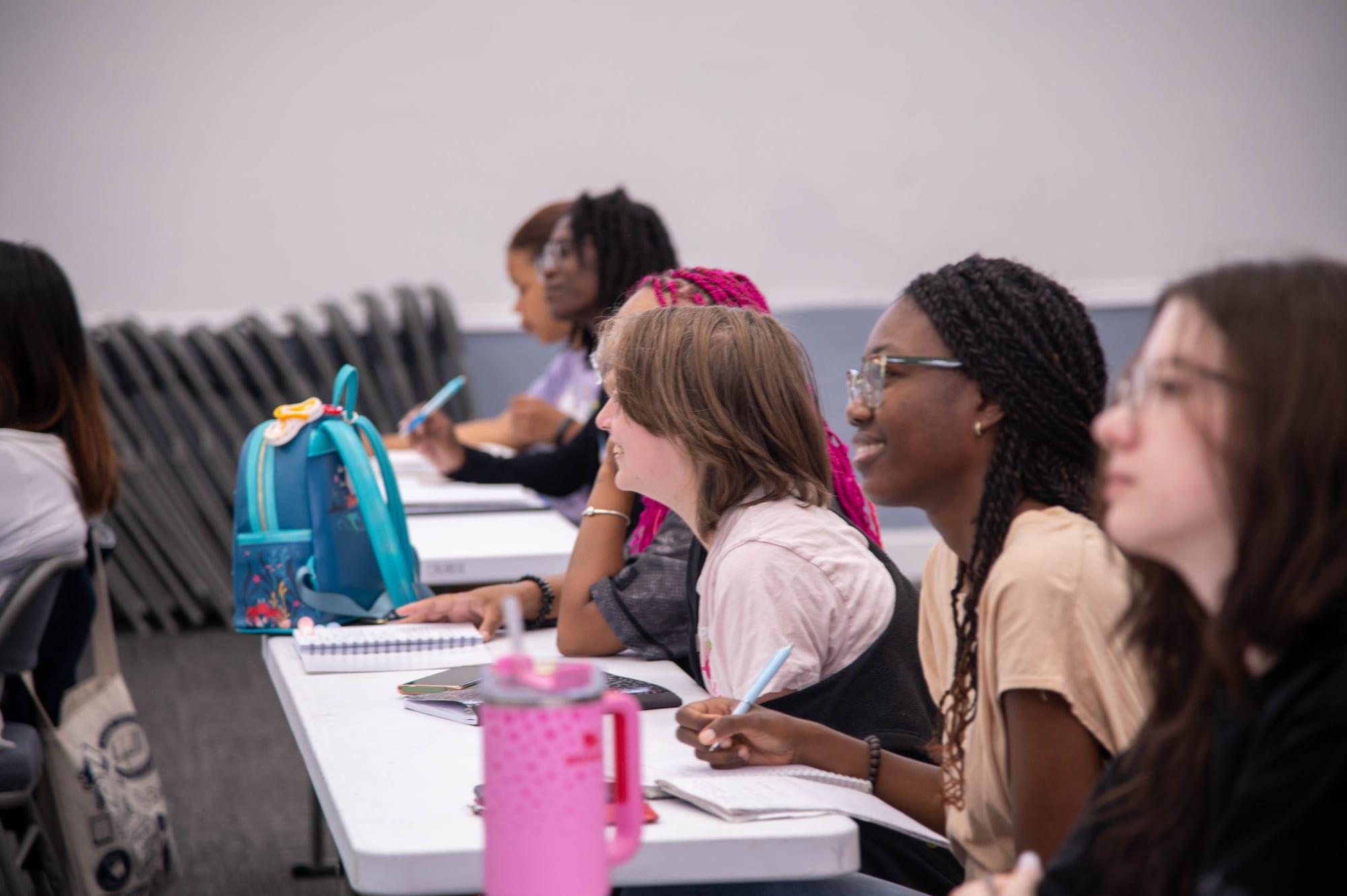 Students taking notes in a Korean Language School class
